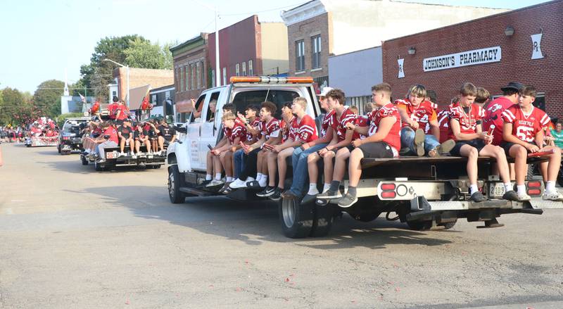 The Hall High School football team rides during the Homecoming parade on Thursday, Sept. 18, 2025 downtown Spring Valley.