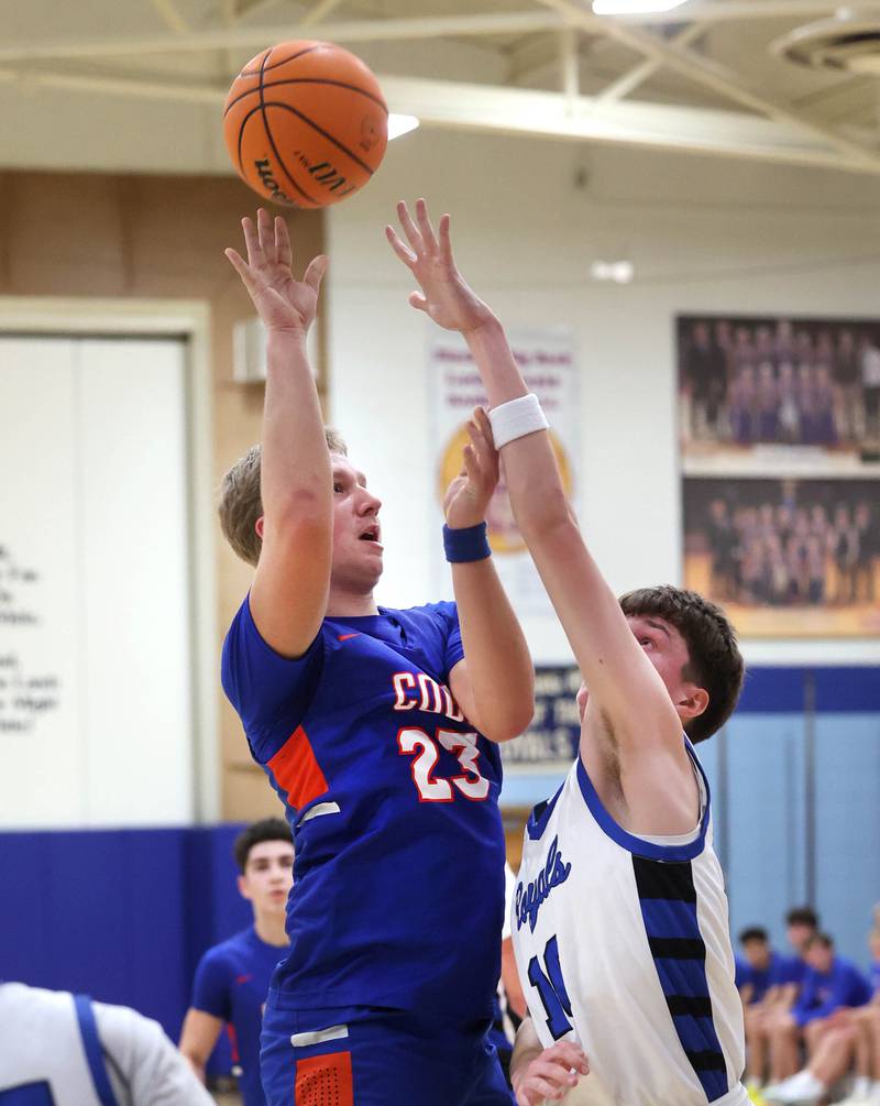 Genoa-Kingston's Hayden Hodgson shoots over Hinckley-Big Rock's Max Hintzsche during their game Tuesday, Jan. 7, 2025, at Hinckley-Big Rock High School.