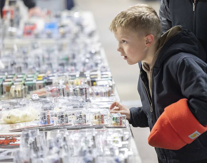 Wilson Henert, 7, of Ashton gets a closer look at a display of vehicles Sunday, March 15, 2026, at the Sublette Antique Tractor and Toy Show. Five different buildings displayed a menagerie of collectibles.