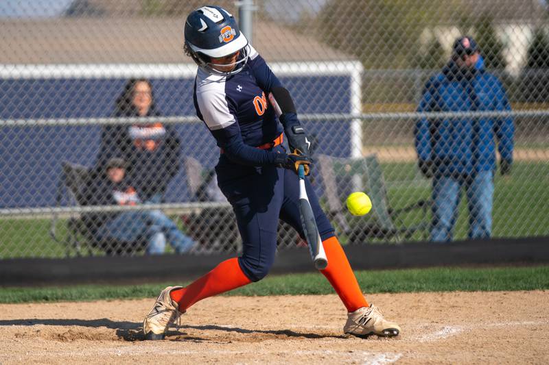 Oswego’s Jaelynn Anthony (20) singles against Oswego East during a softball game at Oswego East High School on Friday, April 21, 2023.