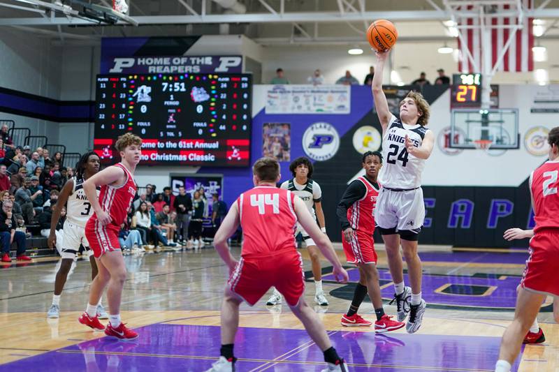 Kaneland’s Luke Reinert (24) shoots a floater in the paint against Streator during a semi-final basketball game in the 61st annual Plano Christmas Classic at Plano High School on Friday, December 27, 2024.
