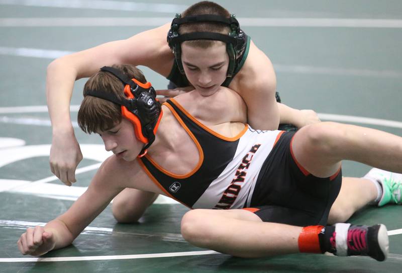 St. Bede's Michael Benge wrestles Sandwich's Dom Urbanski in the 113 pound weight class during the Class 1A Regional meet on Saturday, Feb. 8, 2025 at St. Bede Academy.