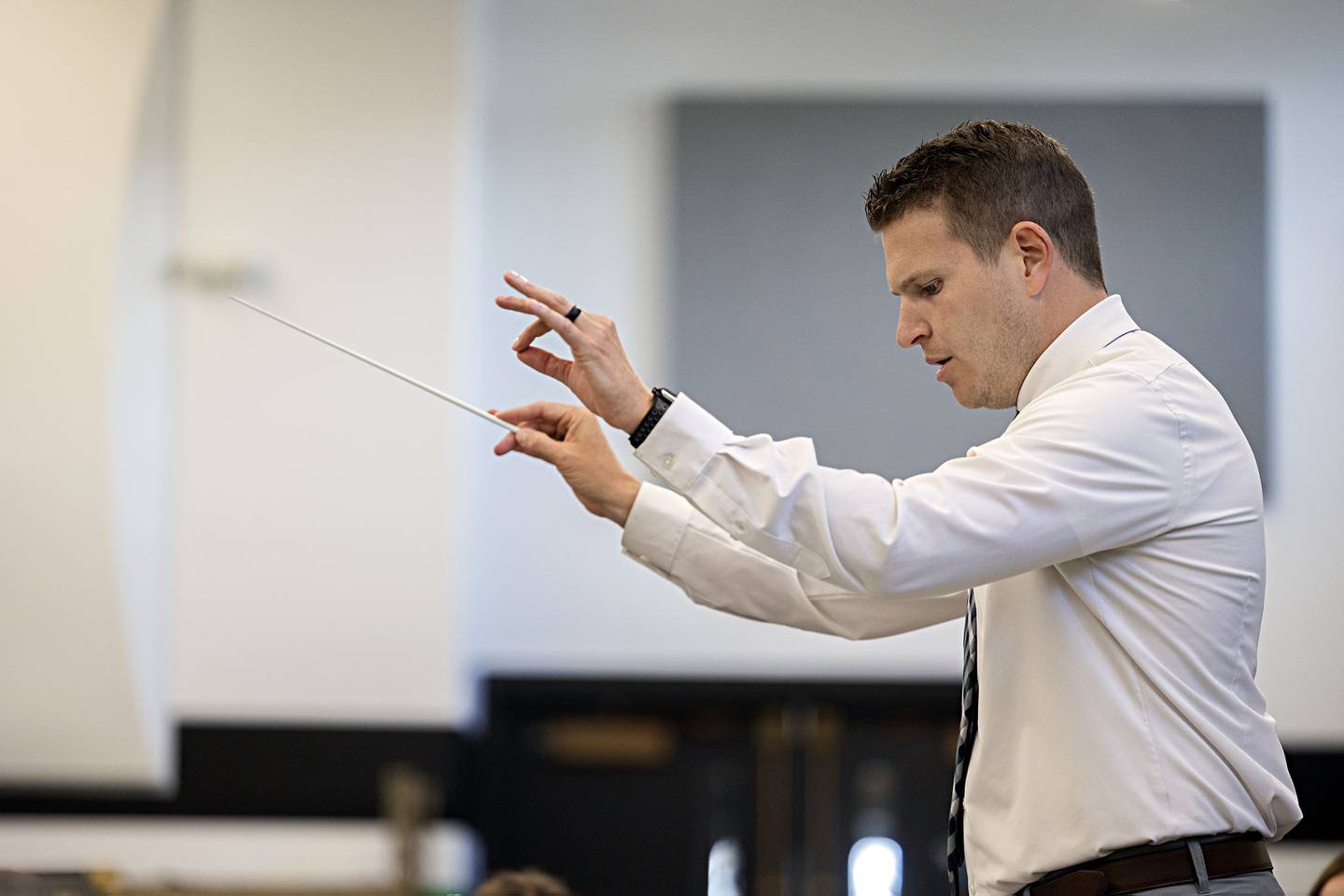 Rock Falls band director Patrick Anderson leads his group during practice Tuesday, April 11, 2023.