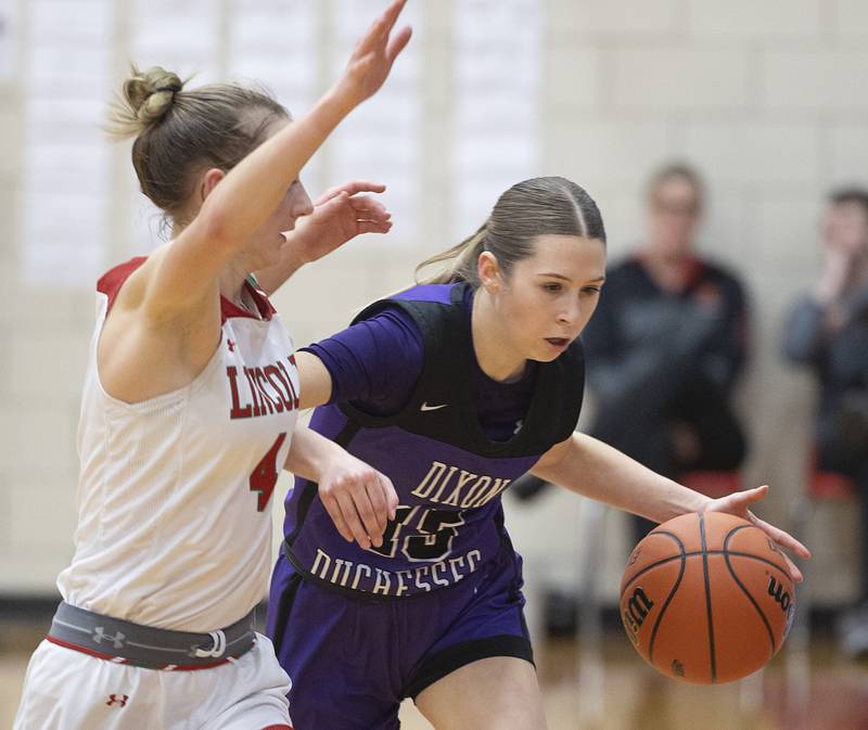 Dixon’s Morgan Hargrave brings the ball up against Lincoln’s Becca Heitzig in the class 3A super sectional Monday, Feb. 26, 2024 at LaSalle-Peru High School.