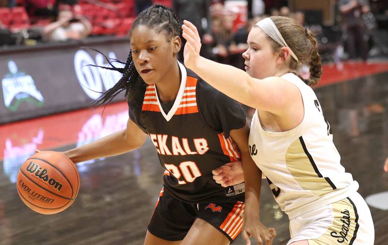 DeKalb's Olivia Schermerhorn tries to get by Sycamore's Sophia Klacik during the First National Challenge Friday, Jan. 27, 2023, at The Convocation Center on the campus of Northern Illinois University in DeKalb.