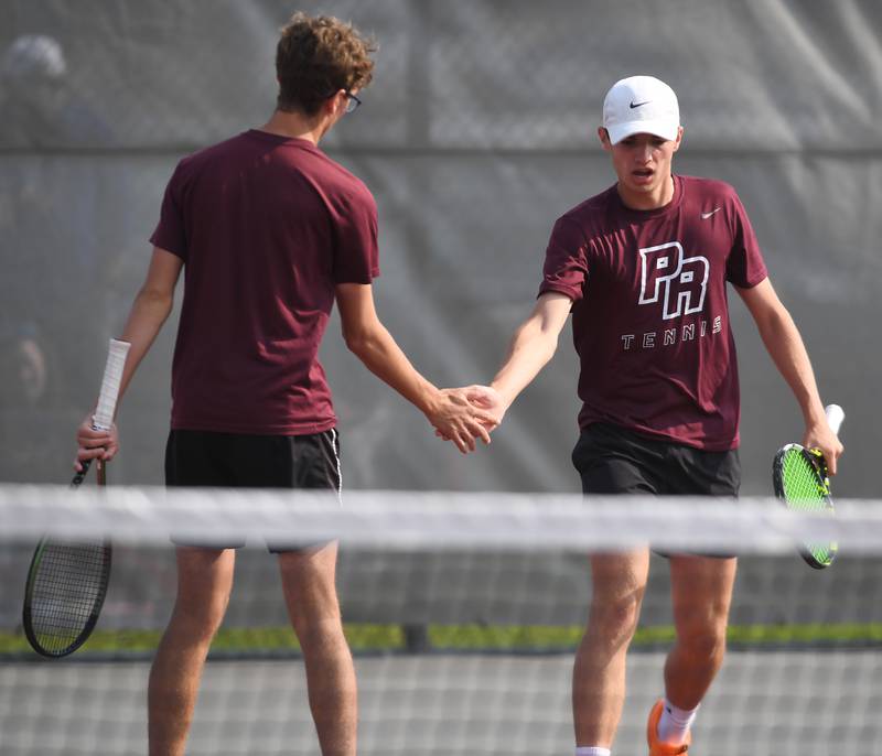 Tim Jones, left, and Cole Palese of Prairie Ridge celebrate a point while competing in Class 1A doubles during the boys state tennis tournament on Saturday, May 31, 2025 in Palatine.