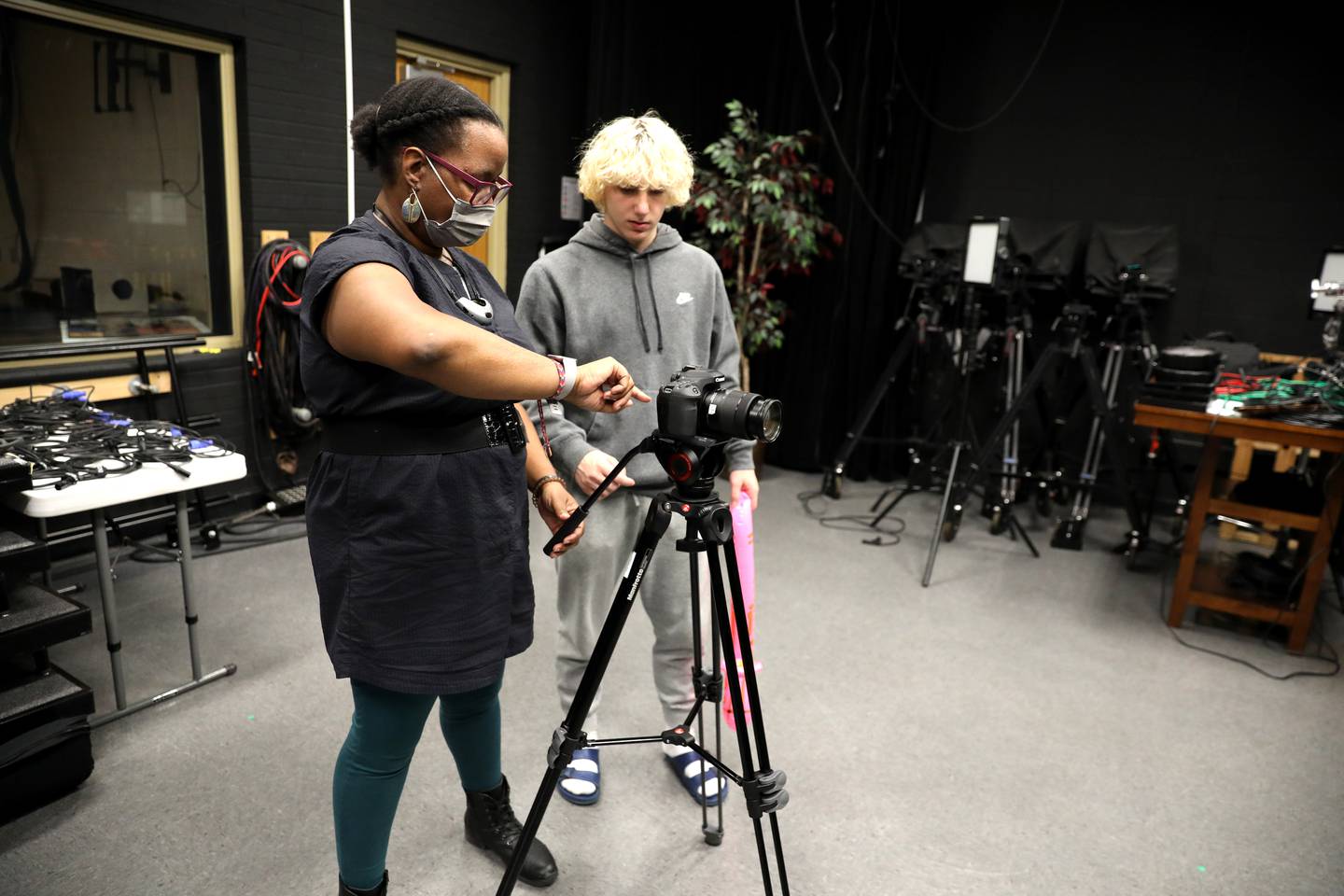 Jennifer Carpenter works with Ryan Fors in a video production class at Batavia High School.