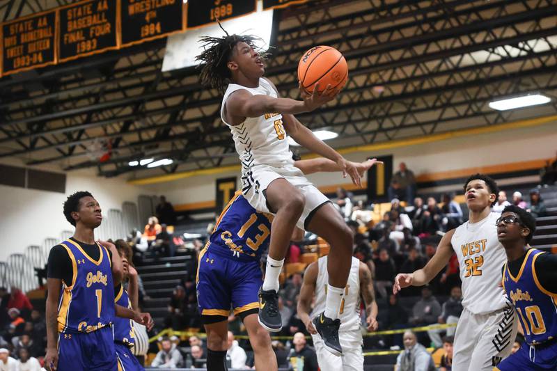 Joliet West’s Aamir Shannon lays in a shot against Joliet Central on Tuesday, Dec. 3, 2024 in Joliet.