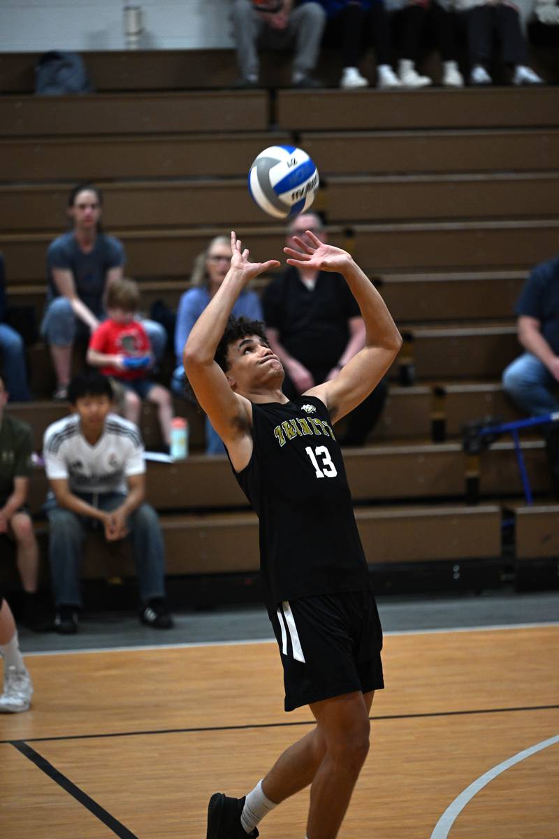 Kankakee Trinity Academy's Corey Hathaway sets the ball during the game against Manteno on Thursday, May 1, 2025.