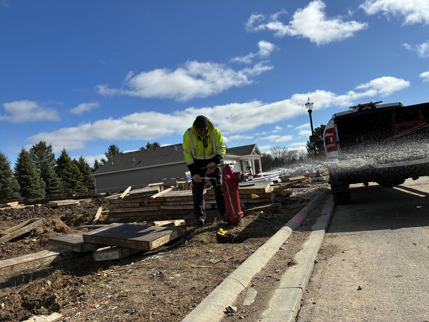 An employee from M.E. Simpson Co., Inc., prepares a Wonder Lake hydrant for a fire flow test on Friday, March 27, 2026.