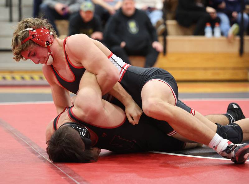 Yorkville's Luke Zook goes up against against Plainfield North's Julian De La Rossa during the Southwest Prairie Conference wrestling meet at Yorkville High School on Saturday, Jan. 21, 2023.