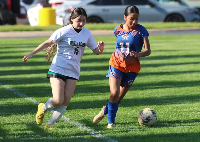 Genoa-Kingston's Nayelli Gonzalez saves the ball from going out-of-bounds Thursday, April 23, 2026, during their game against North Boone at Genoa-Kingston High School.