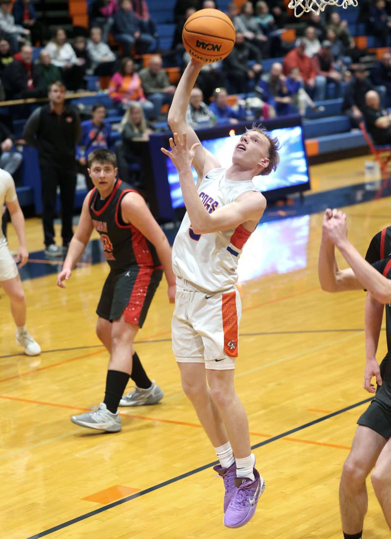 Genoa-Kingston's Blake Ides gets a layup in front of Indian Creek's Payton Hueber during their game Friday, Jan. 2, 2026, at Genoa Kingston High School.