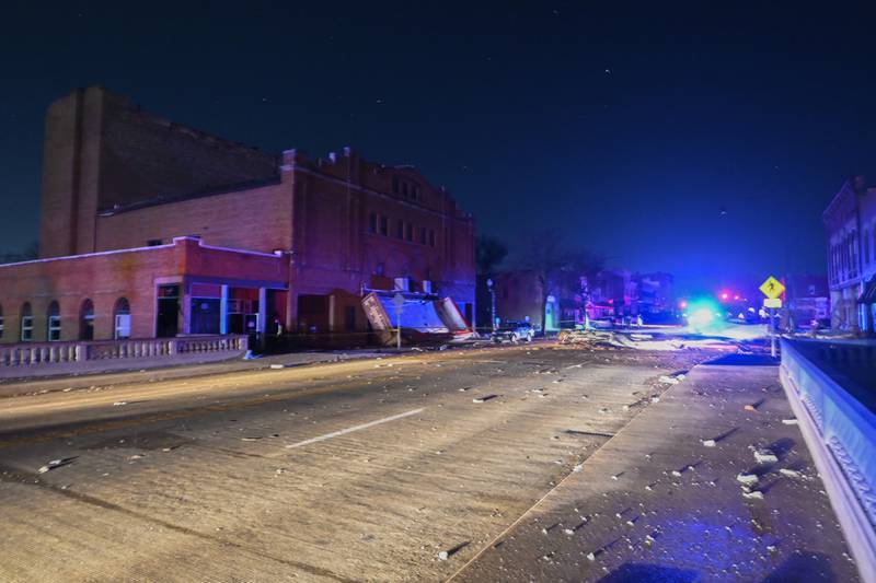 Rubble is seen near the Apollo Theatre, early Saturday, April 1, 2023, after a severe spring storm caused damage and injuries, in Belvidere, Ill. (AP Photo/Matt Marton)