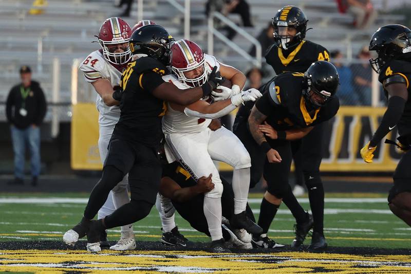 Morris’ Griffin Zweeres powers his way forward on a run against Joliet West on Friday, Sept. 6, 2024 in Joliet.