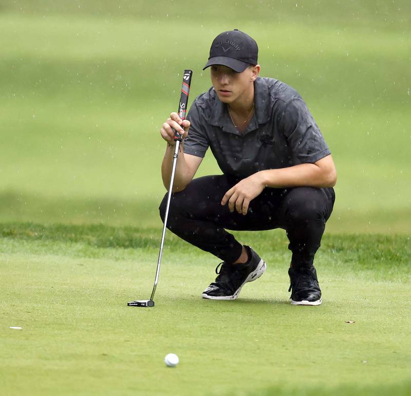 Giovanni Barghini, Glenbard North, looks for the break of the green during the DuKane Conference Boys Varsity Tournament Tuesday, Sept. 24, 2024 Bartlett Hills Golf Club.