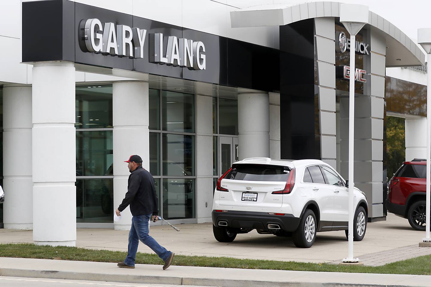 A man walks into the former Gary Lang Auto Center in McHenry on Oct. 11, 2022, The longtime McHenry Dealership was recently sold and has become the Castle Autoplex McHenry.
