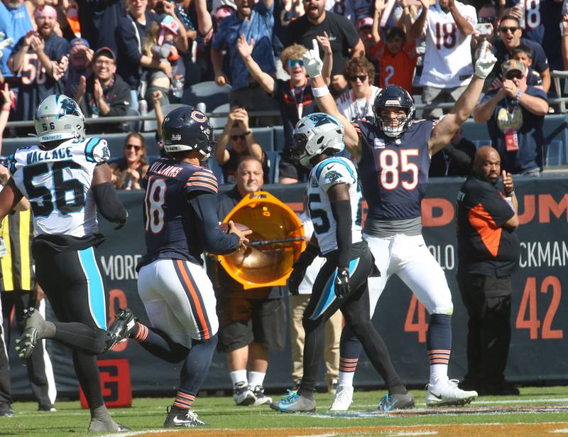 Chicago Bears quarterback Caleb Williams scores a touchdown as teammate Cole Kmet reacts on Sunday, Oct. 6, 2024 at Soldier Field in Chicago.