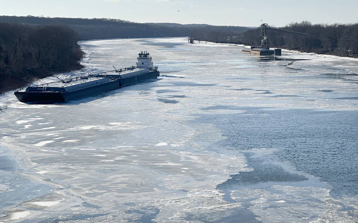 A barge rests in icy waters on the Illinois River on Tuesday, Jan. 14, 2025 near Utica. With the sub-zero temperatures, the Illinois River is expected to freeze over in the next few days.