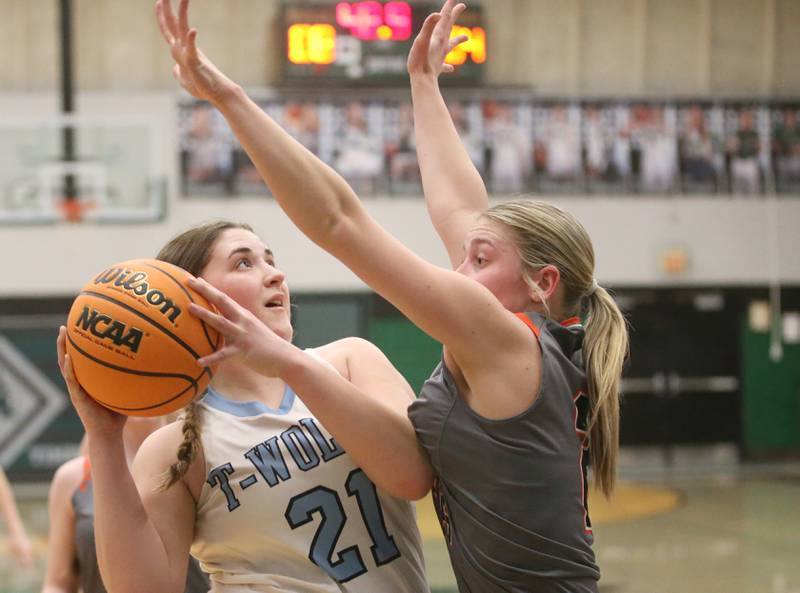Cissna Park's Lauryn Hamrick eyes the hoop as Flanagan-Cornell/Woodland's Kora Edens defends during the Class 1A Sectional semifinal game on Tuesday, Feb. 25, 2025 at Midland HIgh School.