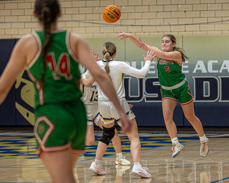 Emma Jereb (5) of LaSalle-Peru passes ball to teammate over Marquette's full-court defense on Saturday, January 3, 2026 at Marquette Academy in Ottawa.