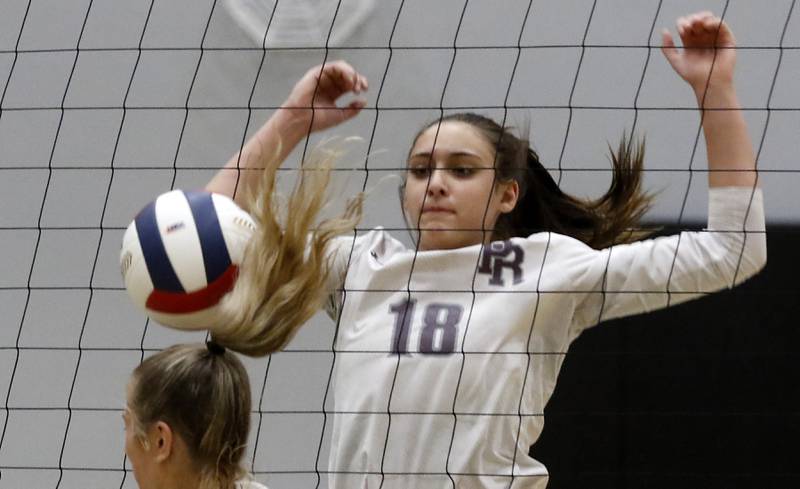 Prairie Ridge's Maizy Agnello watches as the ball heads towards Belvidere North's Olivia Tremund head during the Class 3A Woodstock North Sectional finals volleyball match on Wednesday, Nov. 1, 2023, at Woodstock North High School.