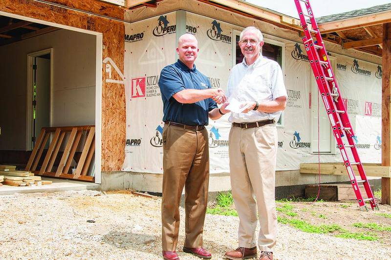 KSB Hospital in Dixon, a 20-plus-year Habitat partner, recently donated funds to Dixon Habitat for Humanity. With the check are David Schreiner (left), KSB president and CEO, and the Rev. David Spaulding, vice president of Habitat. Photo submitted by Megan Scholl.