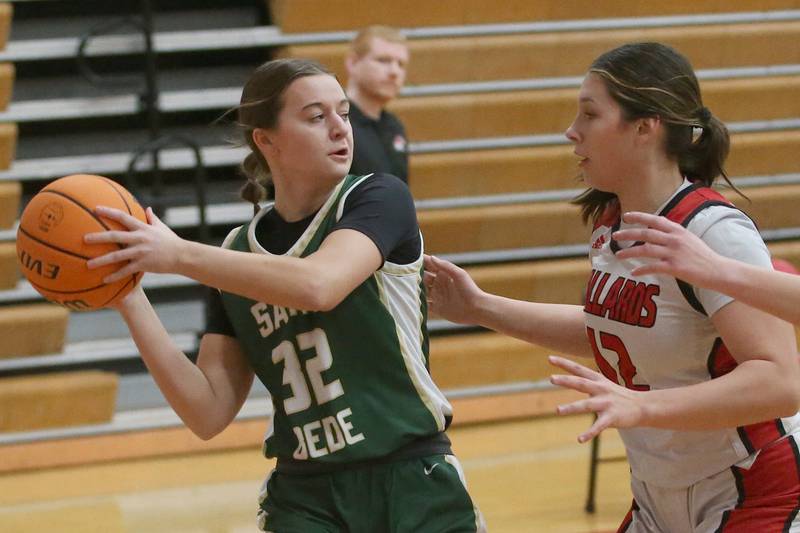 St. Bede's Quinn McClain looks to pass the ball around Henry-Senachwine''s Kaitlyn Anderson on Thursday, Jan. 30, 2025 at Henry-Senachwine High School.