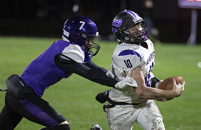 Plano’s Kaiden Schmandle is pushed out of bounds by Dixon’s Cort Jacobson Friday, Oct. 27, 2023 in Dixon.