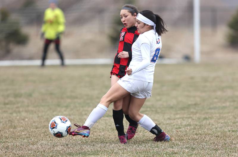 Indian Creek's Sally Diaz (left) and Genoa-Kingston's Anna Martinez meet at the ball during their game Thursday, March 16, 2023, at the Pack Park Sports Complex in Waterman.