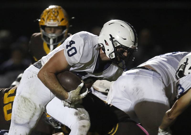 Cary-Grove's Logan Abrams runs for a touchdown during a Fox Valley Conference football game against Jacobs on Friday, Oct. 24, 2025, at Jacobs High School in Algonquin.