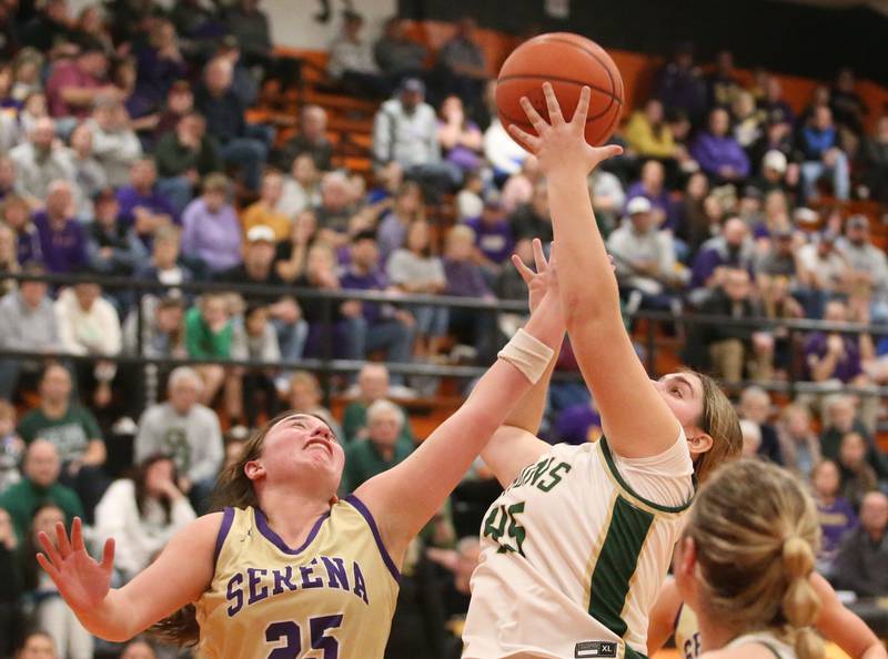 St. Bede's Savannah Bray grabs a rebound over Serena's Maddie Glade during the Class 1A Sectional final game on Thursday, Feb. 22, 2024 at Gardner-South Wilmington High School.