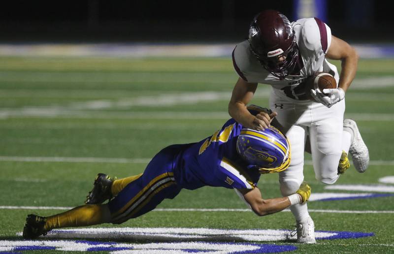 Johnsburg's Landon Johnson tackles Marengo's Noah DePew during a Kishwaukee River Conference football game on Friday, Oct. 4, 2024, at Johnsburg High School.