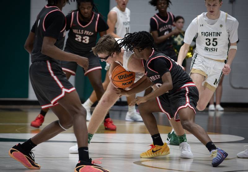 Bishop McNamara's Callaghan O'Connor picks the ball from Chicago Bulls Prep's Anthony Devon Foster Jr., right, in a game on Friday, Decemeber 19, 2025.