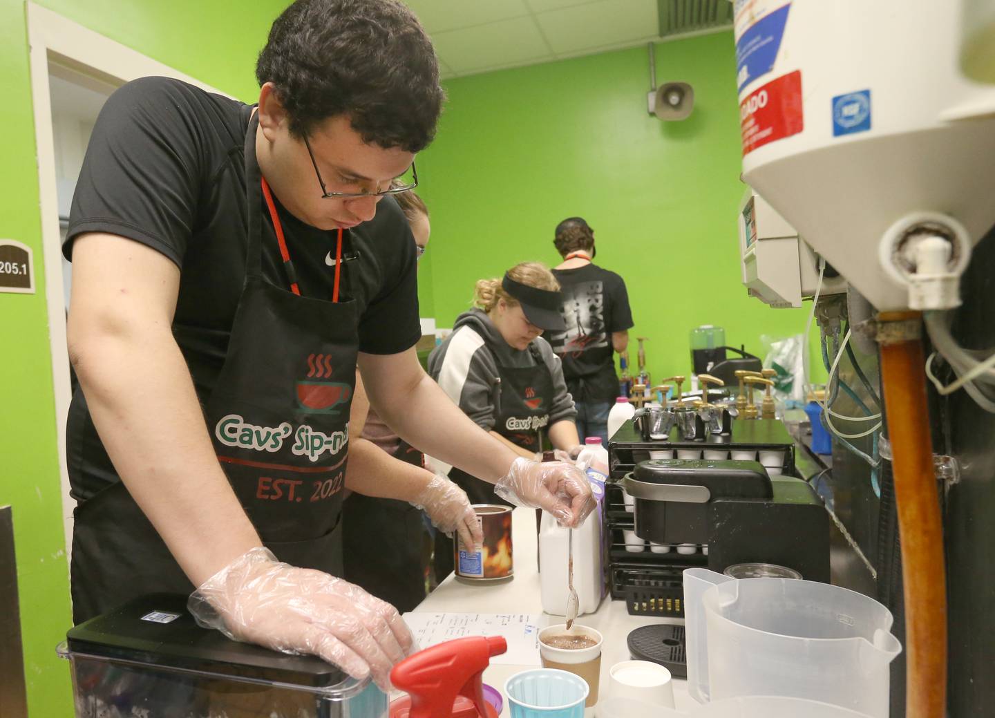 Eric Poole, a student at La Salle-Peru Township High School, makes a hot chocolate during the Sim-n-Savor program on Tuesday, Sept. 26, 2023 in the schools cafeteria.