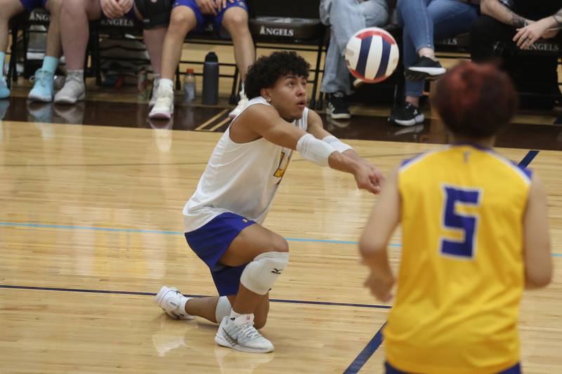 Joliet Central’s Luis Rita Rondon digs a shot against Joliet Catholic on Wednesday, April 1, 2026 in Joliet.