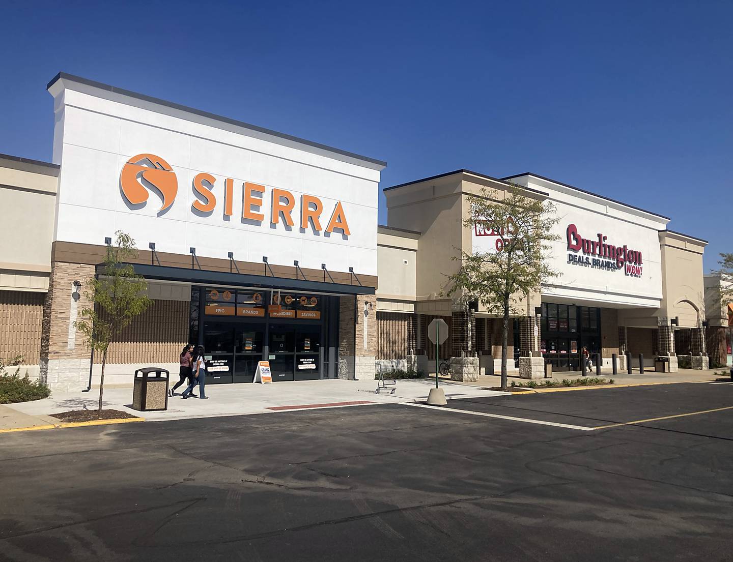 People walks past the Sierra store  and the recently opened Burlington store in Crystal Lake, on Thursday, Oct. 3, 2024. The new Sierra store will open on Saturday, Oct. 5.