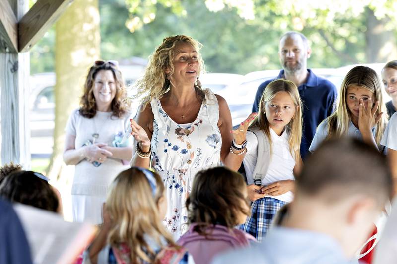 St. Anne’s principal Talarie Bilharz welcomes students and parents back to school Wednesday, Aug. 13, 2025, for the 2025-26 school year.
