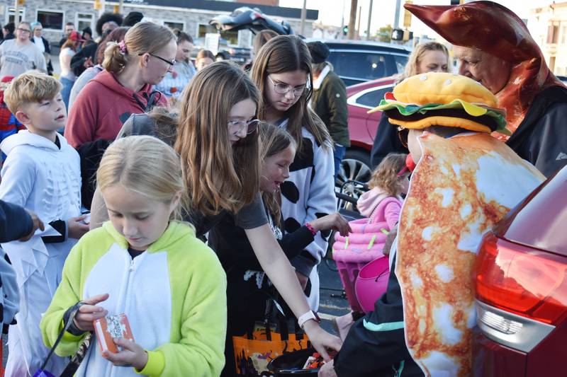 Kids trick-or-treat at the Biz Boo! Halloween event in Rock Falls on Friday, Oct. 24, 2025.