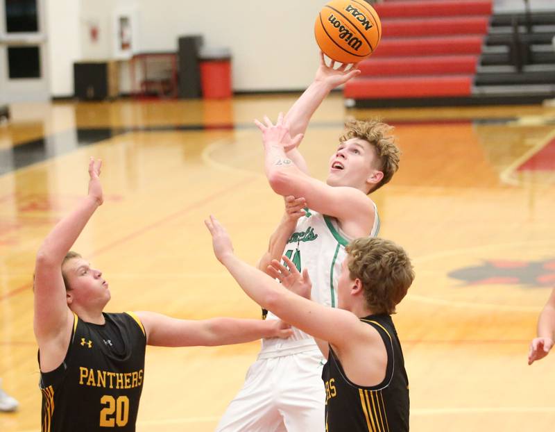 Rock Falls's Austin Castaneda eyes the hoop against Putnam County's AJ Furar during the 50th annual Colmone Classic on Monday, Dec. 9, 2024 at Hall High School.
