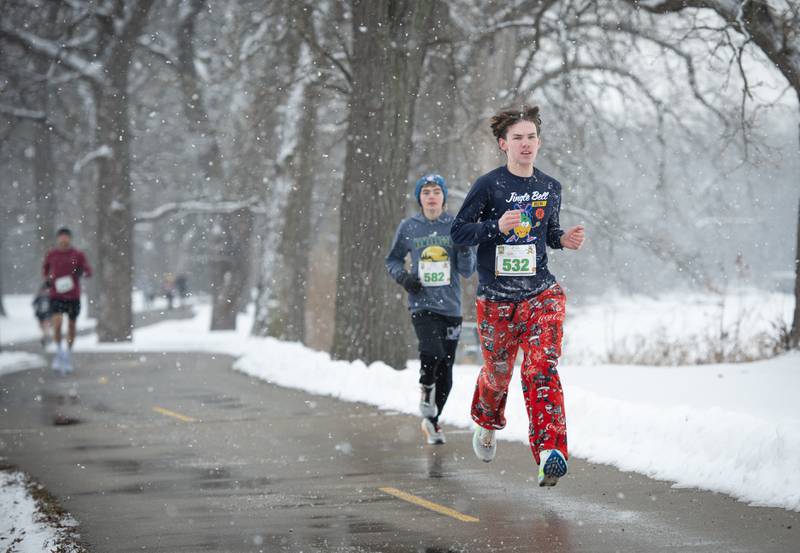 Brayden Pawlak, 17, right, a senior at Manteno High School participates in the 35th annual Jingle Bell Run at Kankakee Community College on Sunday, December 7, 2025.
