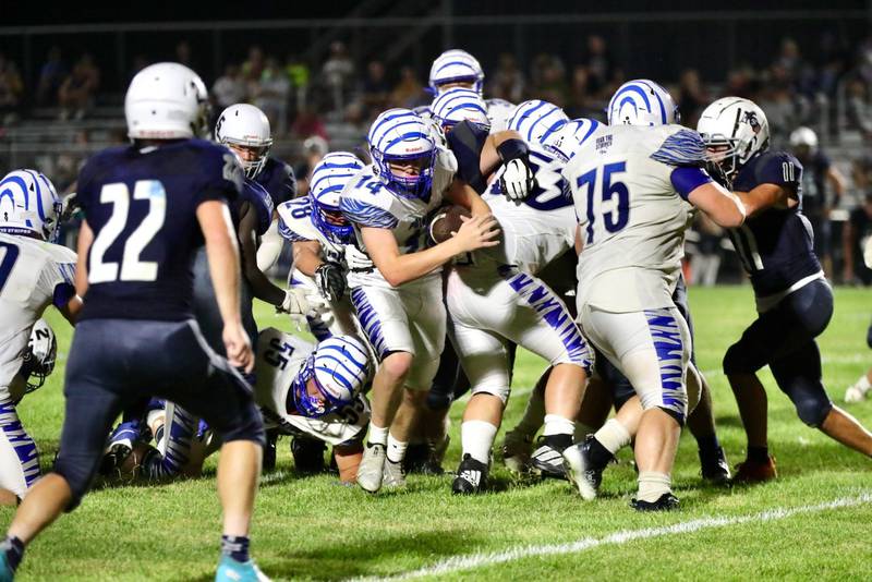 Princeton quarterback Will Lott runs the ball at Monmouth-Roseville Friday night. Princeton won 40-0.