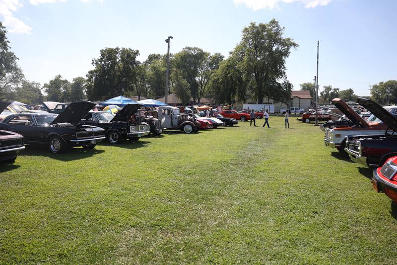 People check out the vintage and customer vehicles at the Crest Hill Lions Luau and Car Show on Sunday, Sept. 1, 2024 in Crest Hill.