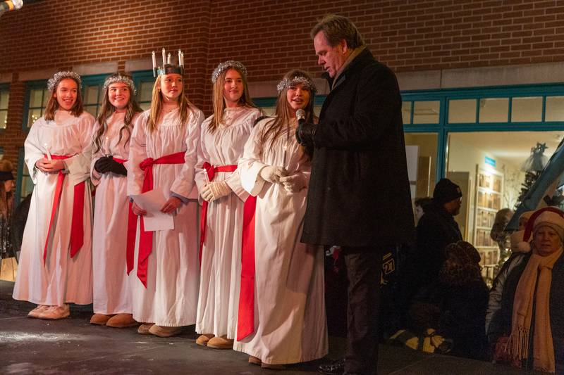 St. Lucia Girl's talk with Mayor Kevin Burns at the Annual Geneva Christmas Walk on Friday, Dec. 5, 2025 in Geneva.