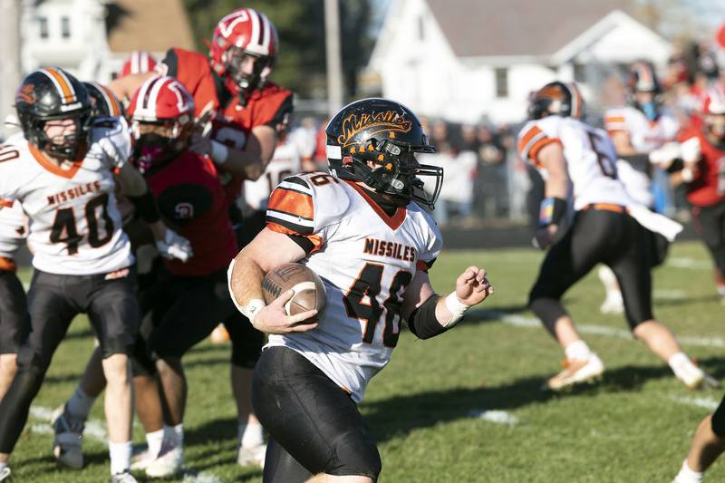 Milledgeville’s Spencer Nye runs the ball against Amboy’ Saturday, Nov. 15, 2025, in the 8-man football semifinal.