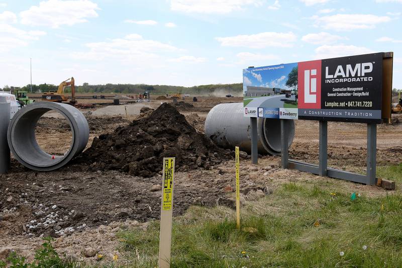 Construction crews work on building a new elementary school, yet unnamed, across from the Lakewood Crossing development at the intersection of Big Timber Road and Ridgecrest Drive on Friday, May 14, 2021, in Hampshire.