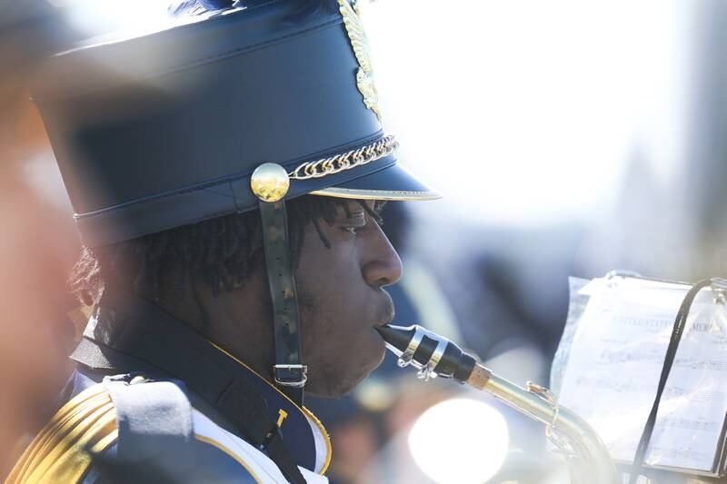 Joliet West’s band plays the National Anthem in the cross town rival matchup on Saturday.