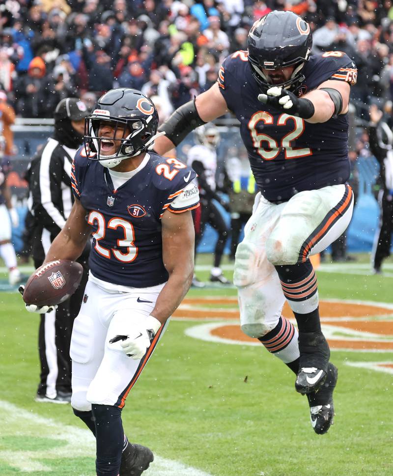 Chicago Bears running back Roschon Johnson celebrates his touchdown with guard Lucas Patrick during their game against the Atlanta Falcons Sunday, Dec. 31, 2023, at Soldier Field in Chicago.