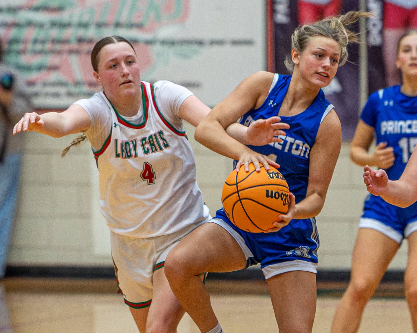 Madie Gibson (4) of Princeton holds ball as L-P's Alexus Hines (4) reaches in on Saturday, Feb. 7, 2026 in Sellett Gymnasium at L-P High School.
