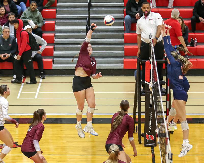 Lockport's Bridget Ferriter (17) spikes the ball during Class 4A Bolingbrook Sectional final match between Lockport at Oswego.  Nov 7, 2024  in Bolingbrook.
